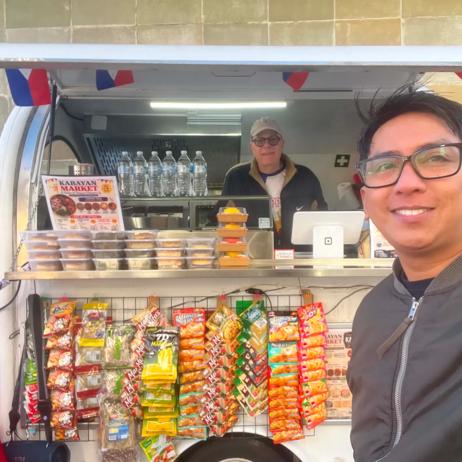 Arcee and Kulander with the Kabayan Market food trailer